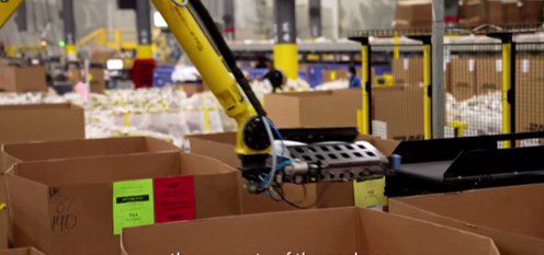 robotic arm proprietary coveyor end effector at DHL
